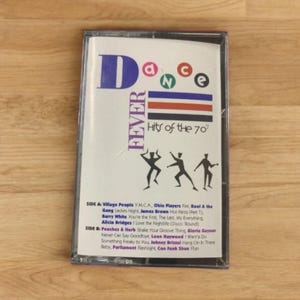 May include: A vintage cassette tape for "Dance Fever: Hits of the 70s." The cover features the word "Dance" in blue, green, and red, with the word "Fever" in purple. The tracklist includes artists like Village People and Barry White.