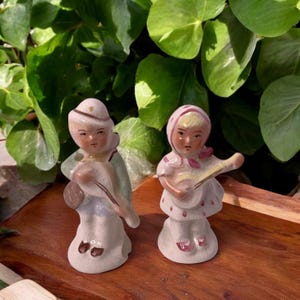 Vintage Dutch Or German Girl And Boy Collectible Ceramic Figurines Playing Guitars Stamped 5070A And 5071A