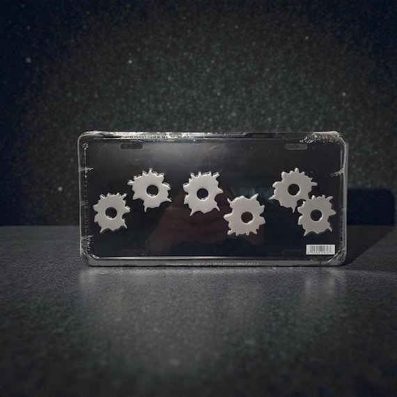 Vintage 1990s Stamped Metal License Plate Frame with Bullet Holes, Made in USA