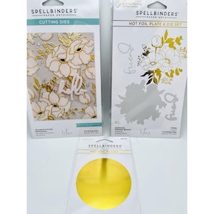 May include: Three Spellbinders Paper Arts packages: a Wonderful Script Sentiments cutting die set, an Anemone Glimmer Blooms hot foil plate and die set, and a package of gold hot foil plates, all displayed in their original retail packaging.
