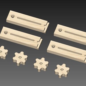 May include: Four wooden blocks with a groove and a hole in each. There are five wooden knobs with a star shape.