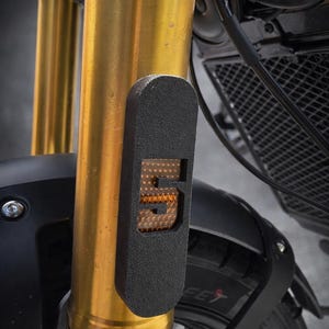Pair of fork reflector covers designed specifically for Triumph Scrambler 400 X.