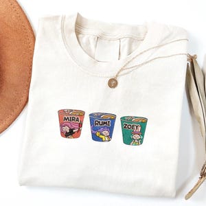 KPOP Band Huntrix Embroidery Sweatshirt, Kpop Idol Group Shirt, Mira, Rumi, Joey Shirt, Gift for Huntrix Fan,Noodle Ramyeon KPOP Embroidered