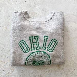May include: Gray sweatshirt with a green "OHIO" logo and a green seal with the text "Universitatis Ohiensis, Religio, Doctrina, Civilitas".