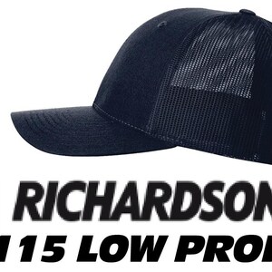 May include: A solid navy blue baseball cap featuring a structured front panel and a breathable mesh back. The text RICHARDSON 115 LOW PROFILE is displayed below the cap, accompanied by a red square icon containing a white stylized letter R.