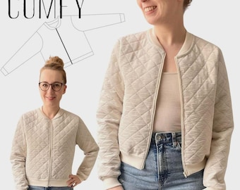 May include: A beige quilted bomber jacket with a diamond pattern, worn by a person in the image. The jacket has a zipper closure and ribbed cuffs and hem. The word "COMFY" is at the top of the image, with the text "A4/AO" and "VEL. 34-44" at the bottom.