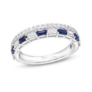 May include: A silver band ring with a row of blue sapphires and a row of smaller diamonds.