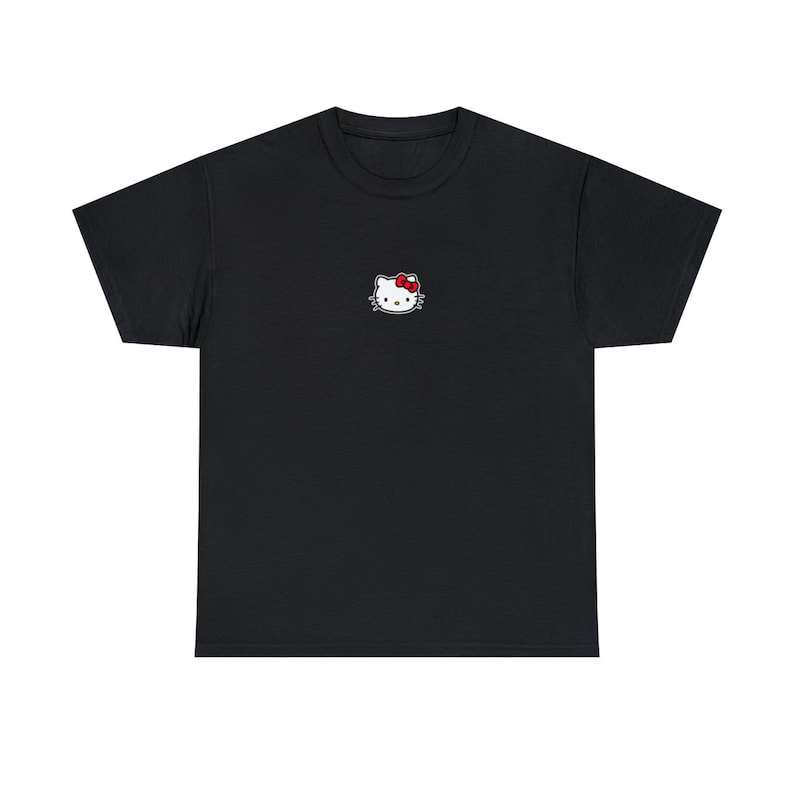 May include: Black t-shirt with a white Hello Kitty embroidered on the front.