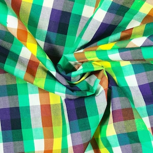 May include: A green, yellow, orange, purple, and white checkered fabric with a woven texture.