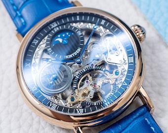 Grawerowany automatyczny zegarek mechaniczny Skeleton Dual Time: różowe złoto, czarna tarcza, niebieski pasek skórzany