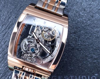 Relógio mecânico automático com movimento de ponte esquelética: ponteiros luminosos, pulseira de aço inoxidável em ouro rosa
