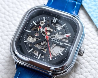 Retro automatisch skelethorloge: zilverzwarte wijzerplaat, blauw leer
