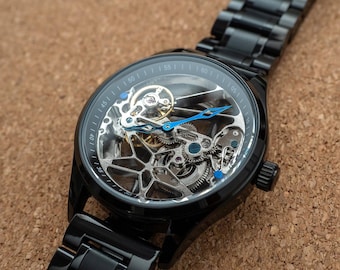 Reloj mecánico automático esqueleto para hombre: negro con correa de acero inoxidable.