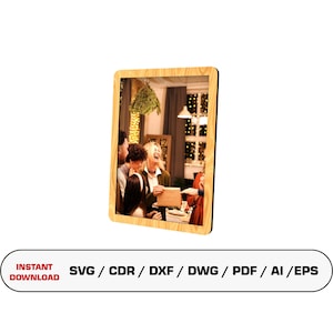 May include: A digital download of a wood-framed photo of a group of people gathered around a table, laughing and exchanging gifts. The photo is set against a backdrop of a decorated room with Christmas lights and a mistletoe hanging from the ceiling. The image includes the text "INSTANT DOWNLOAD SVG/CDR/DXF/DWG/PDF/AI/EPS".