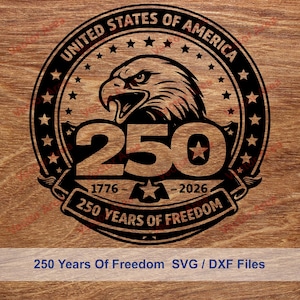 May include: A black and brown graphic design celebrating 250 years of freedom. The design features an eagle, stars, and the text "United States of America" and "250 Years of Freedom". The years 1776-2026 are also included.