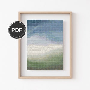 May include: A framed abstract art print with a pixelated design in shades of blue, green, and white. The print is framed in a light wood frame.
