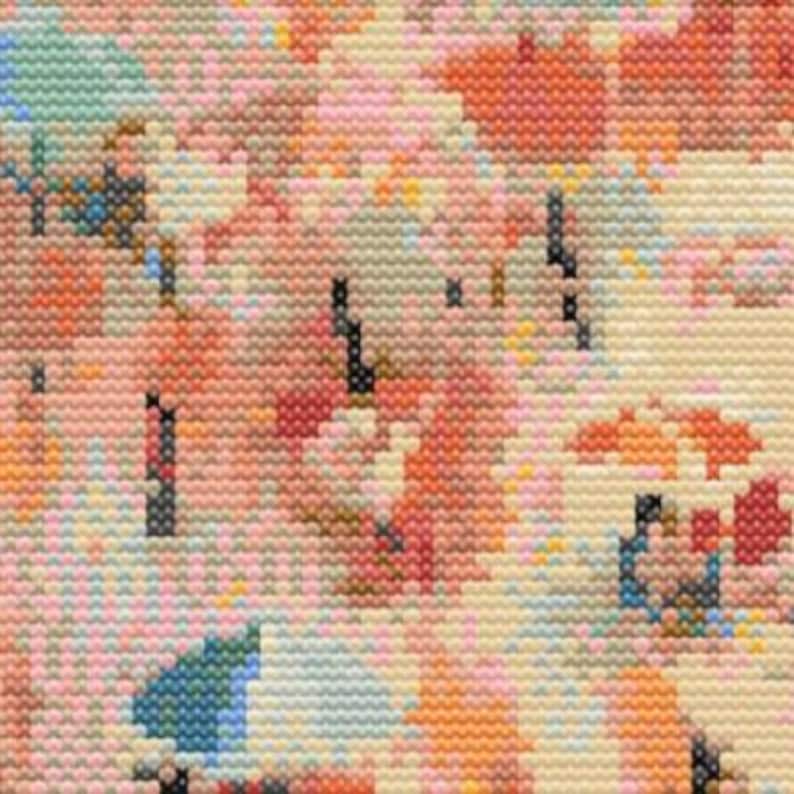 May include: Close-up of a cross-stitch pattern with a floral design. The pattern features a variety of colours, including pink, orange, blue, and yellow. The stitches are small and tightly packed, creating a detailed and textured image.