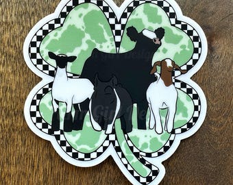 May include: A green four-leaf clover with a black and white checkered border.  Inside the clover are four farm animals: a black and white cow, a white sheep, a black pig, and a brown and white goat.