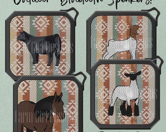 May include: Three square black Bluetooth speakers featuring a patterned background with vertical stripes and geometric shapes. The speakers display illustrations of a black cow, a white goat, and a brown horse. The text reads Outdoor Bluetooth Speakers!