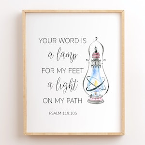 May include: A framed print with a watercolor illustration of a lantern and the text "YOUR WORD IS a lamp FOR MY FEET a light ON MY PATH PSALM 119:105".