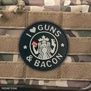 May include: Black and white patch with a stylised image of a mermaid holding a gun and bacon. The text "I ♥ GUNS & BACON" is written around the image.