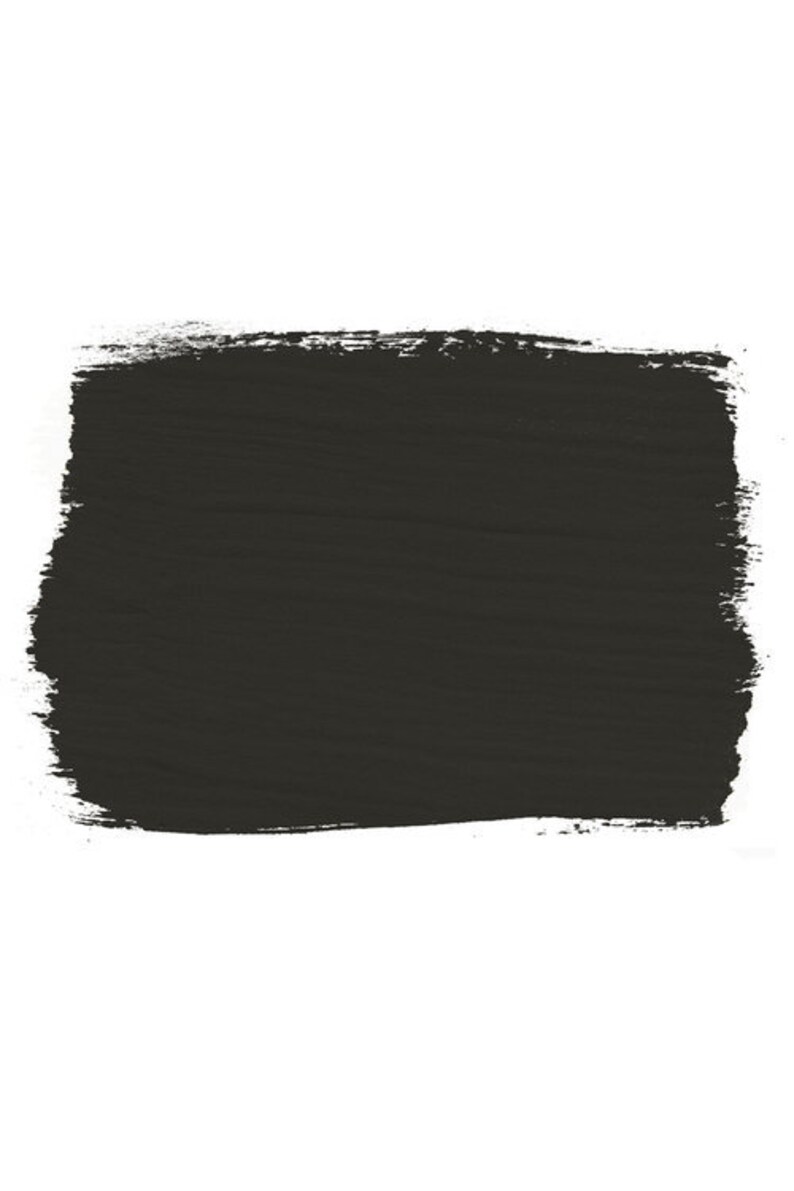 May include: A dark gray paint swatch with a rough, textured surface.