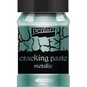 May include: A jar of Pentart cracking paste in a metallic finish. The jar is teal with a black label that reads "cracking paste metallic". The jar has a black lid.
