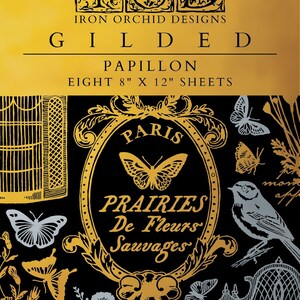 May include: Black and gold decorative paper sheets with butterfly and floral designs. The text reads "GILDED PAPILLON" and "EIGHT 8" X 12" SHEETS". The design includes a bird, butterflies, and the words "PARIS" and "PRAIRIES De Fleurs Sauvages".