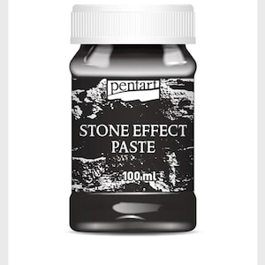 May include: A black plastic jar with a white lid and a black and white label. The label says "Stone Effect Paste" and "100 ml".