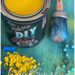 May include: A can of yellow paint with the words "DIY Paint" and "Liquid Sunshine Brighten Your Day" on the label.