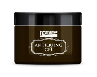 May include: A brown jar with a black lid labeled "Pentart Antiquing Gel".