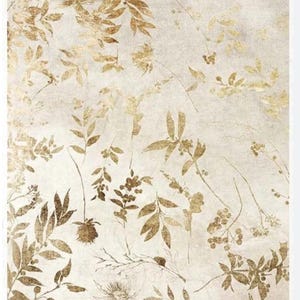 May include: A white background with a gold leaf pattern. The leaves are in various shapes and sizes, and some have small berries. The text "Id. Collection" is at the top of the image.