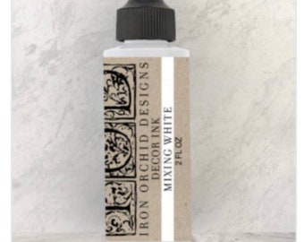 May include: A clear glass bottle with a black cap and a label that reads "Iron Orchid Designs Decor Ink Mixing White 2 fl oz".