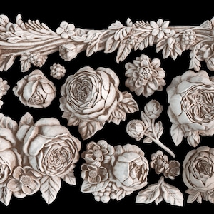 May include: A set of 14 white ceramic floral embellishments, including roses, buds, and leaves. These decorative elements are perfect for adding a touch of elegance to craft projects, home decor, or scrapbooking.