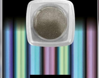 May include: A square, clear container filled with shimmering, metallic-looking eyeshadow. The container sits above a background of vertical, colorful stripes. The text "FIRE GOLD" is displayed in a black rectangle at the bottom of the image.
