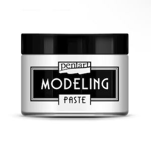 May include: A jar of Pentart Modeling Paste with a black lid and a white label. The label features the brand name and product name in a bold, black font, set against a black border.