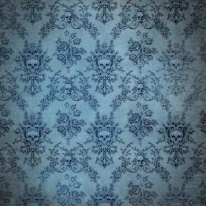 May include: A blue wallpaper featuring a repeating damask pattern with dark blue skulls integrated into the floral and scrollwork design. The surface has a textured, weathered appearance with a subtle gradient from light to dark blue tones.
