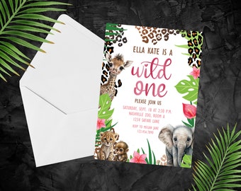 May include: A white invitation card with the text "ELLA KATE IS A wild one" surrounded by illustrations of a giraffe, elephant, and other jungle animals. The invitation includes event details and a RSVP.