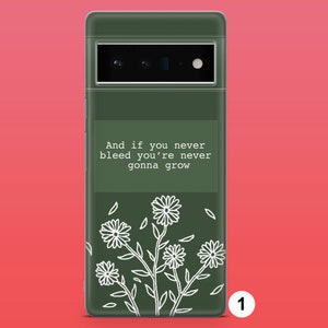 May include: A green phone case with a white floral design and the quote "And if you never bleed you're never gonna grow".