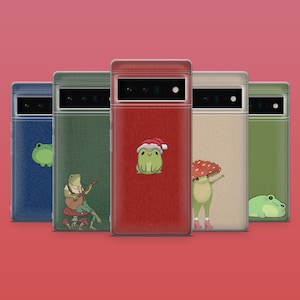 May include: Five phone cases with unique designs. The cases are in various colors, including blue, green, and red. Each case features a different frog illustration, some wearing hats or playing instruments. The cases are arranged against a red background.