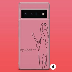 May include: A pink phone case with a black line drawing of a person holding a guitar. The text "long live all the magic we made" is printed on the case.