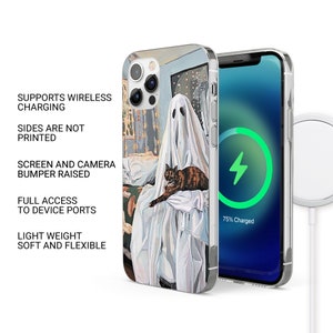 May include: A clear phone case with a colorful illustration of a ghost and a cat. The case is compatible with wireless charging and has a raised bumper to protect the screen and camera.