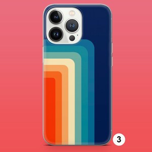 May include: A clear phone case with a retro-style design featuring colorful stripes in shades of blue, orange, yellow, and red. The case is designed for an iPhone with a camera bump.