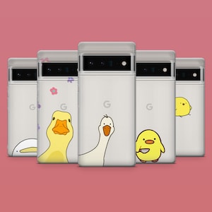 May include: Five white phone cases with different cartoon animal designs. The cases feature a duck, a goose, a chick with a spoon, and a chick with a spoon. The cases are all white with a black outline.