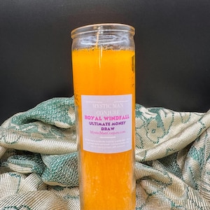 May include: A yellow glass candle with a white label that reads "Mystic Man Conjure Royal Windfall Ultimate Money Draw MysticManConjure.com".