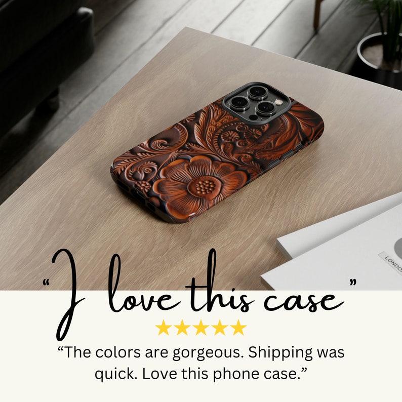 May include: A brown leather phone case with a floral design. The case has a detailed embossed pattern and is on a light brown surface. The text "I love this case" is displayed.