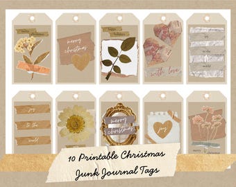 May include: A collection of ten printable Christmas junk journal tags. Each tag features a unique design with dried flowers, paper hearts, and decorative elements. The tags have a vintage aesthetic with text like "merry christmas" and "happy holidays".