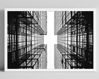 Puede incluir: Fotografía en blanco y negro de dos edificios con una estructura en forma de cuadrícula, vista desde abajo, creando una forma de cruz.