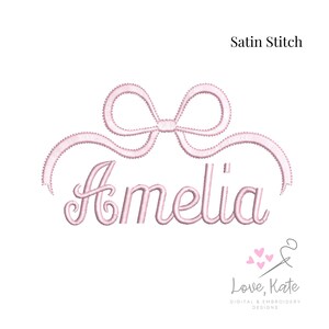 May include: Pink satin stitch embroidery design of a bow with a ribbon and the name Amelia.
