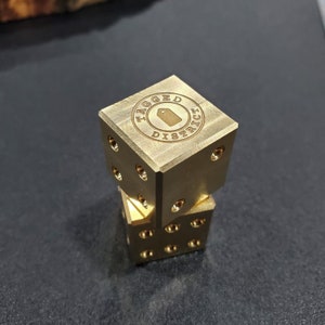 Pair of BRASS D6 DICE USA made 19mm 3/4" billet dice! Custom engraving on the single dot side.